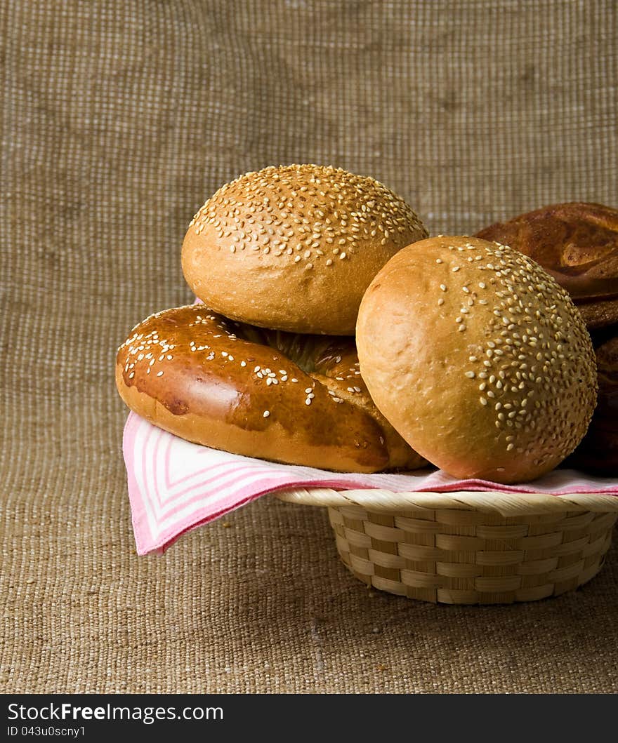 Panary rolls lie on a napkin in a basket