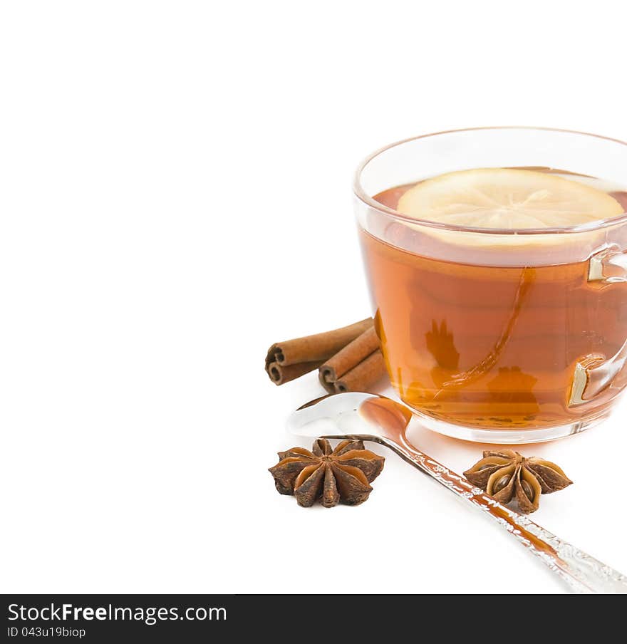 Cup of black tea with a lemon, cinnamon, anise