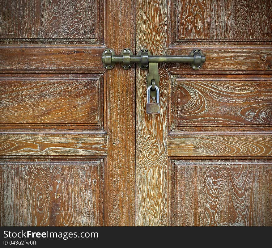 Locked old wooden door safe concept