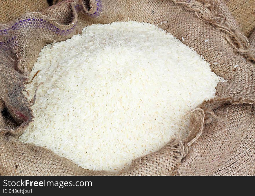 White long rice in burlap sack