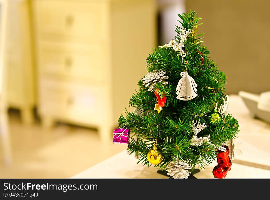 Small Decorated Christmas Tree On Table