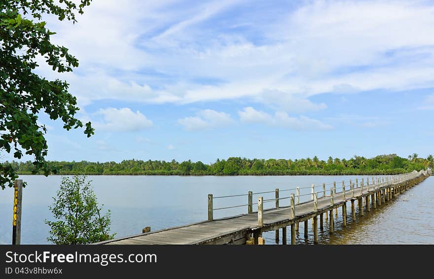 Long wood bridge over a river in, Thailand. Long wood bridge over a river in, Thailand