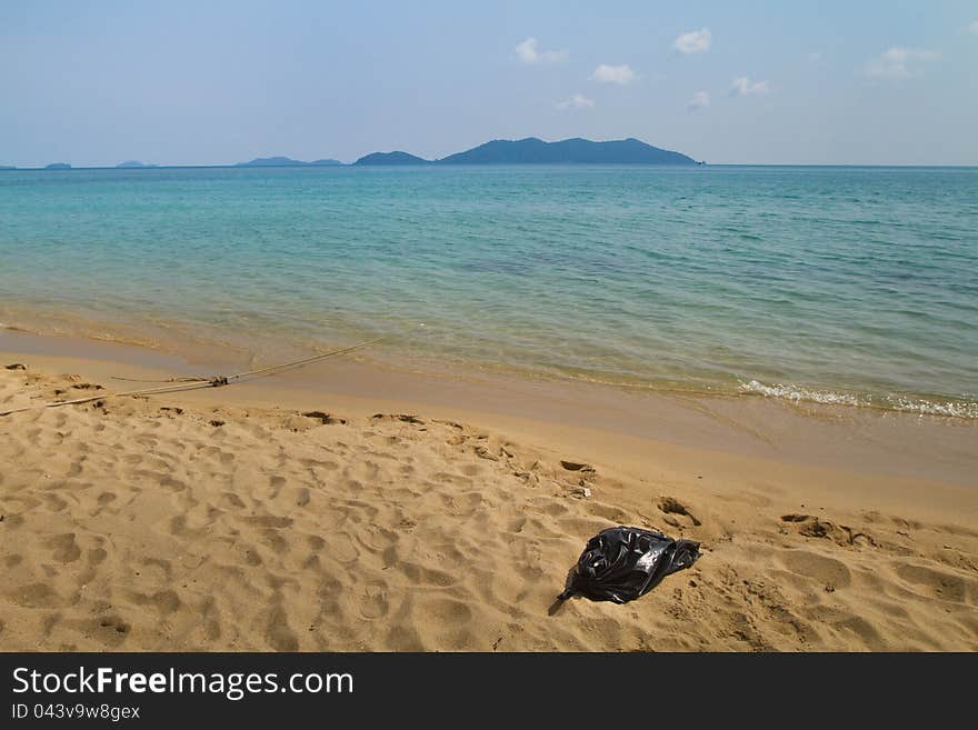 Plastic bag with trash on the beach. Plastic bag with trash on the beach