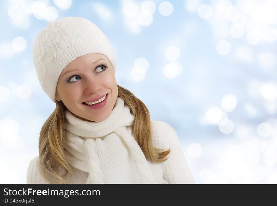 Beautiful happy girl in winter hat and scarf