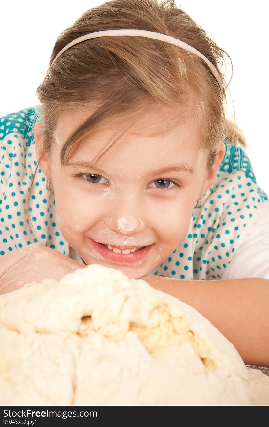 Little girl playing in the kitchen while helping in making bread. Little girl playing in the kitchen while helping in making bread