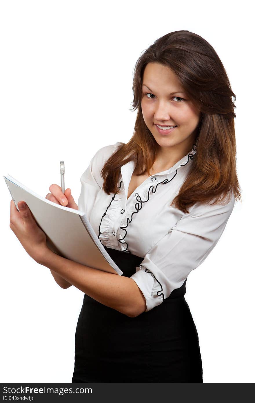 Girl with a notebook and pen on a white background. Girl with a notebook and pen on a white background