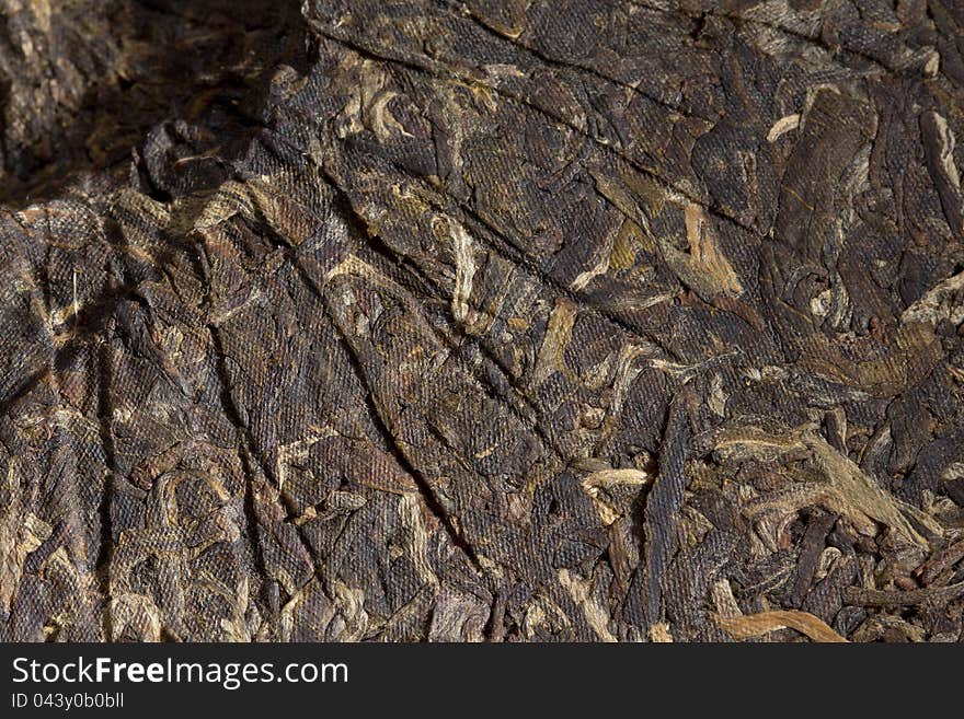 Close photo of a puer green tea cake. Close photo of a puer green tea cake.