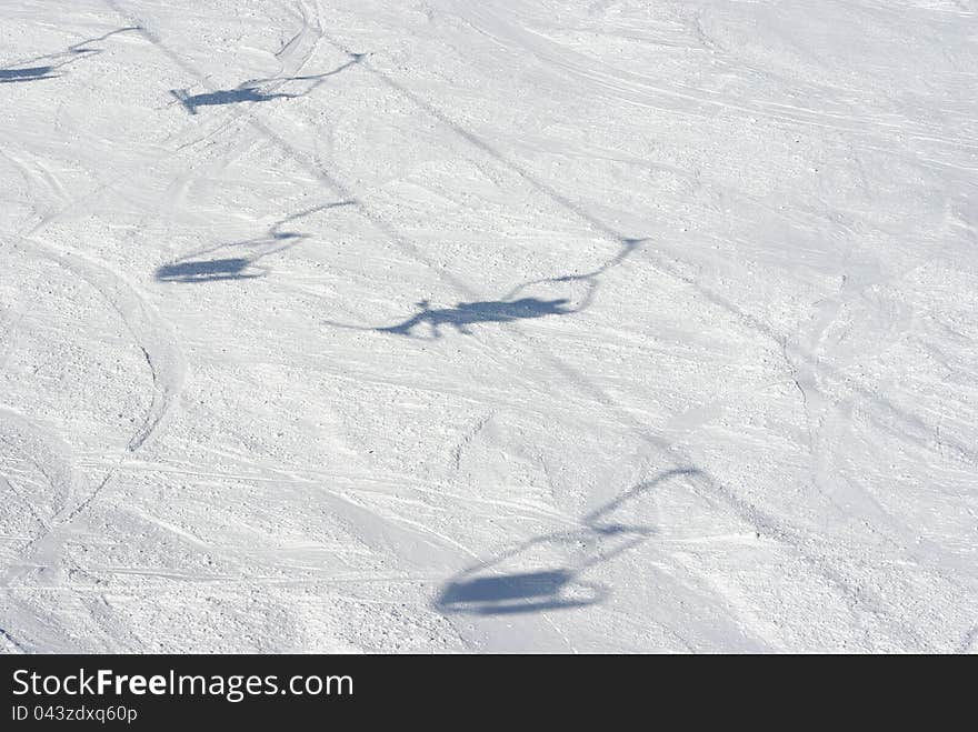 A shadow of a ski lift. A shadow of a ski lift