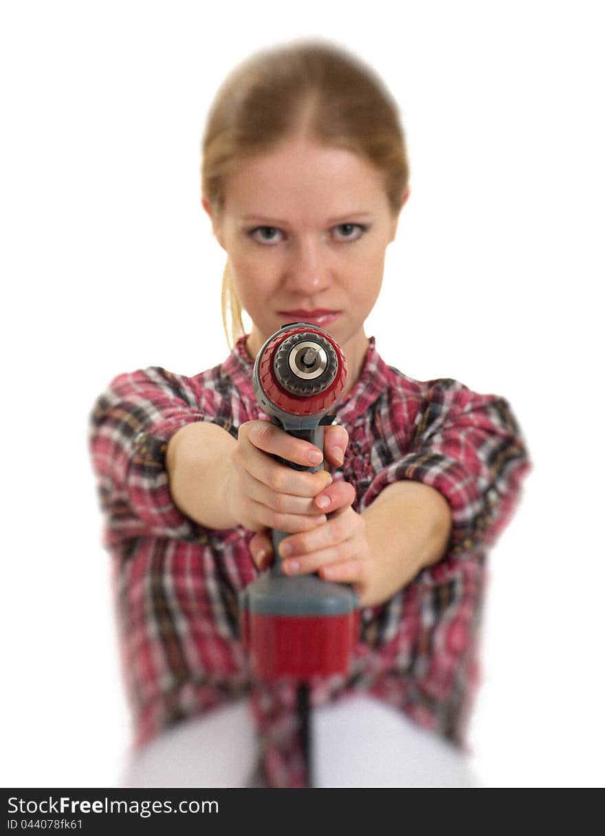 Young cheerful woman with cordless drill