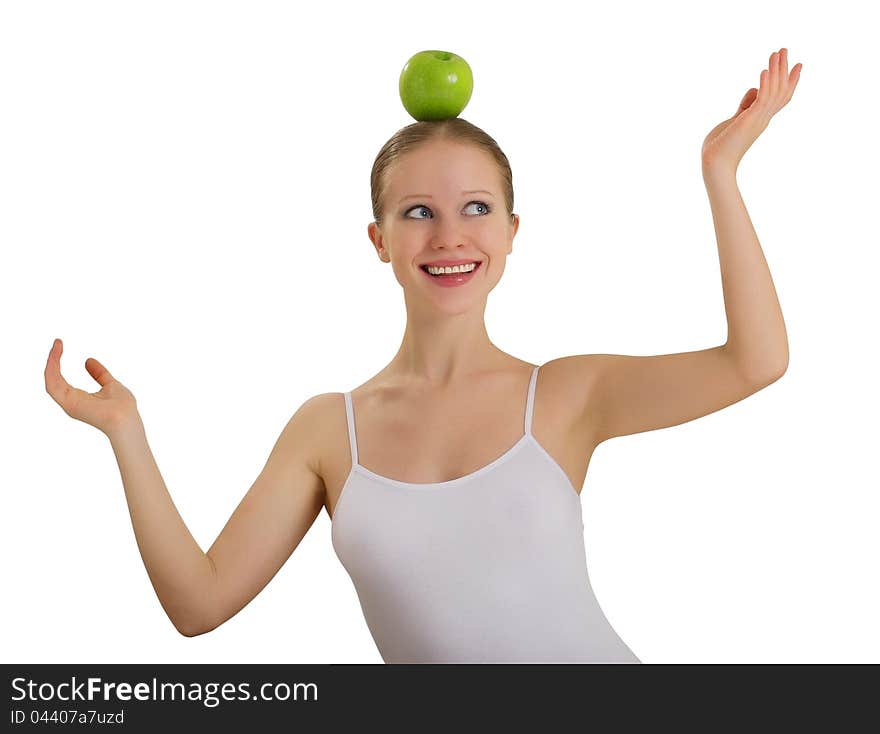 Funny girl balancing on her head with an apple isolated on white background