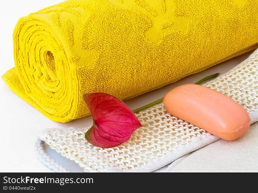 Yellow towel, soap and washcloth