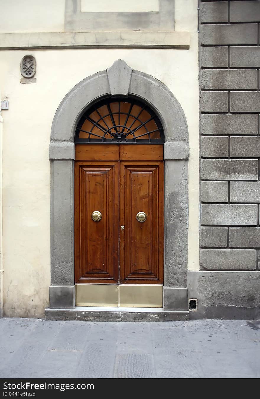 Fragment of old stone building with nice wooden door. Fragment of old stone building with nice wooden door