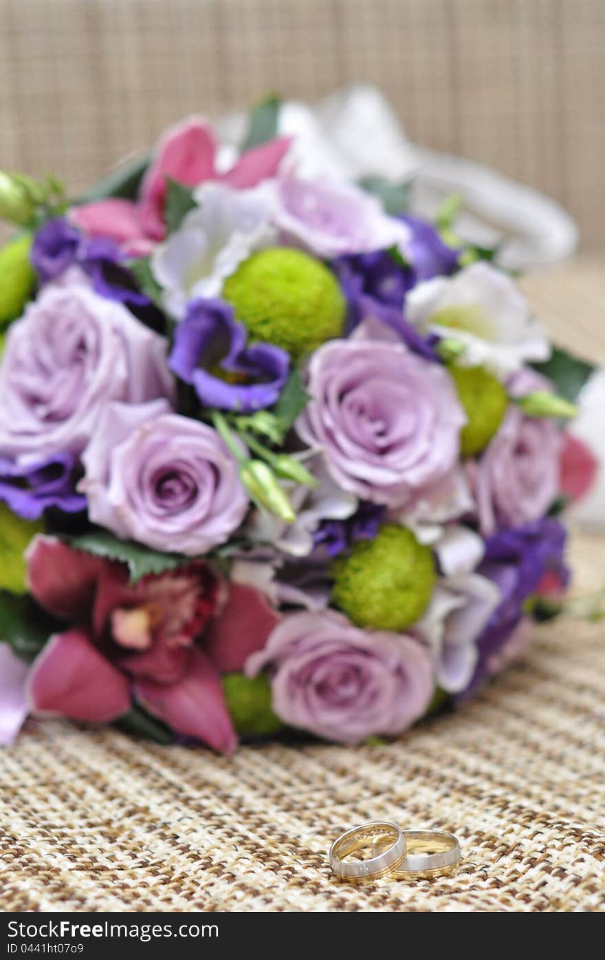 Wedding bouquet and rings isolated