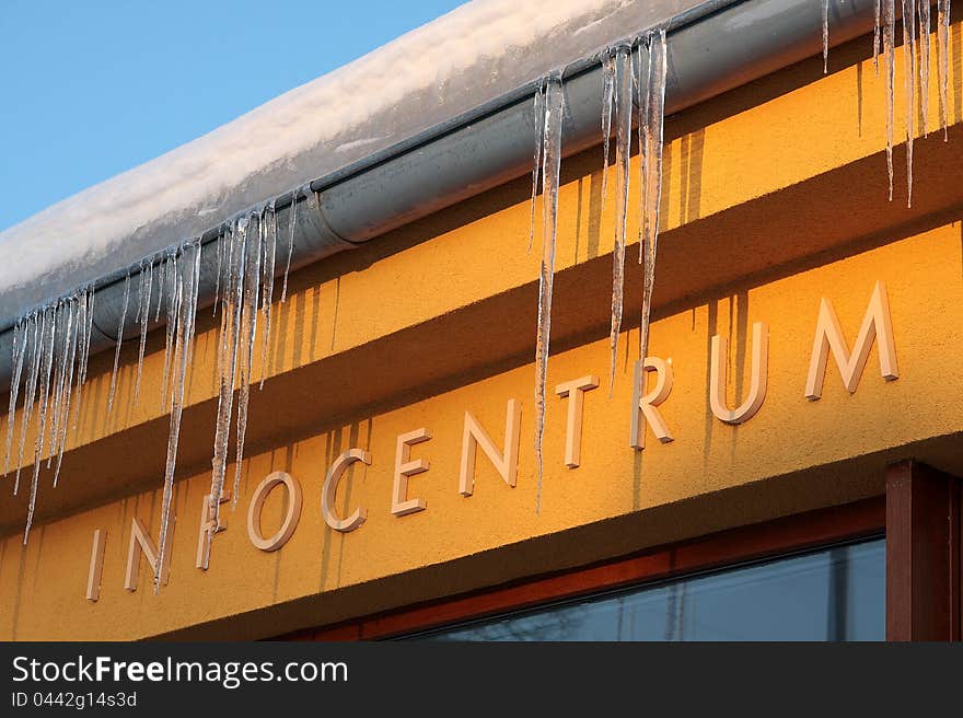 Inscription Infocentrum on a wall of a Information building