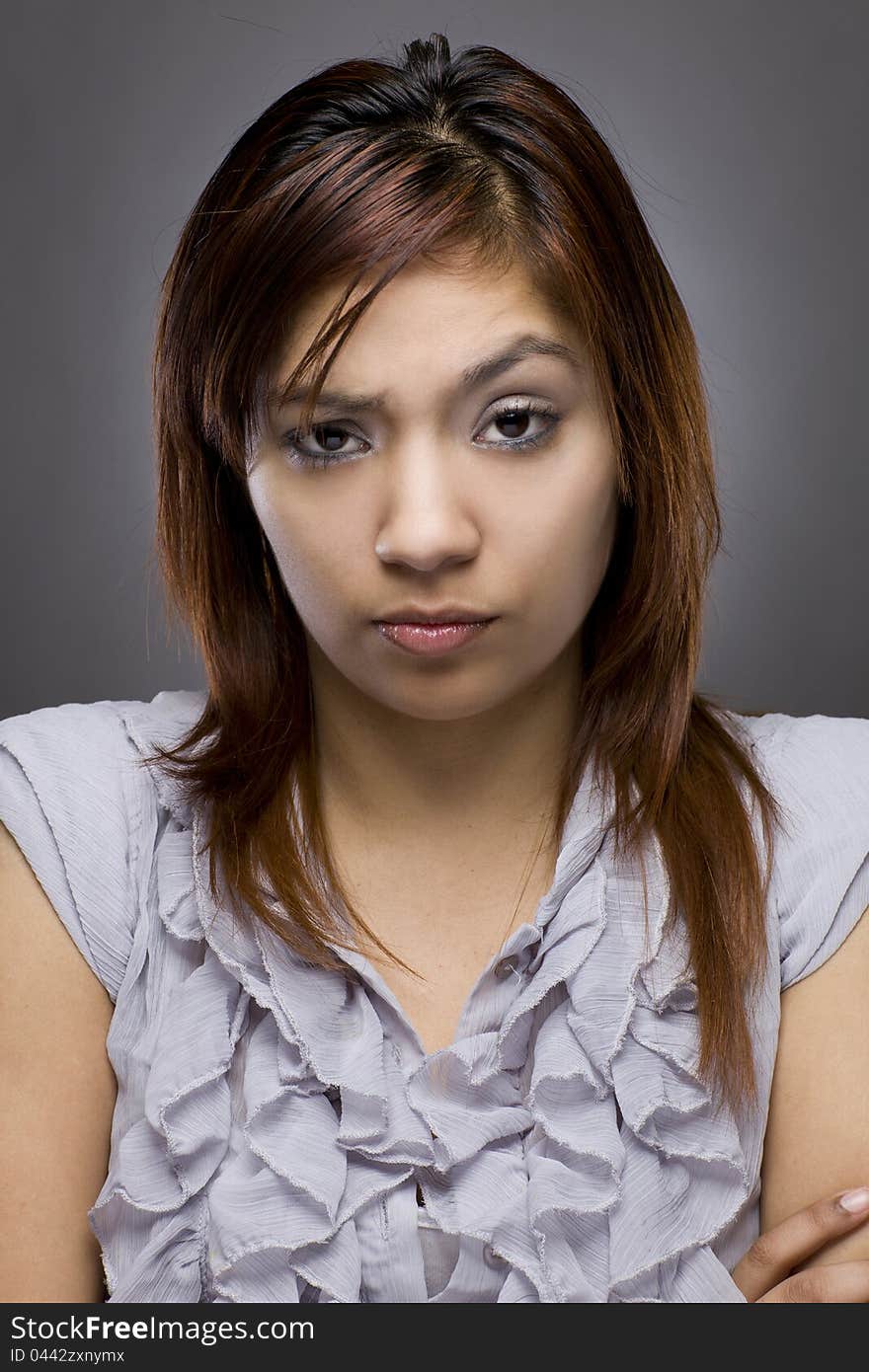 Latino woman looking mad