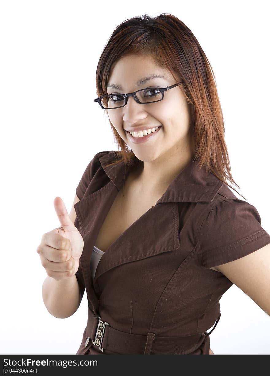 A professional looking latino woman gives a thumbs up. A professional looking latino woman gives a thumbs up