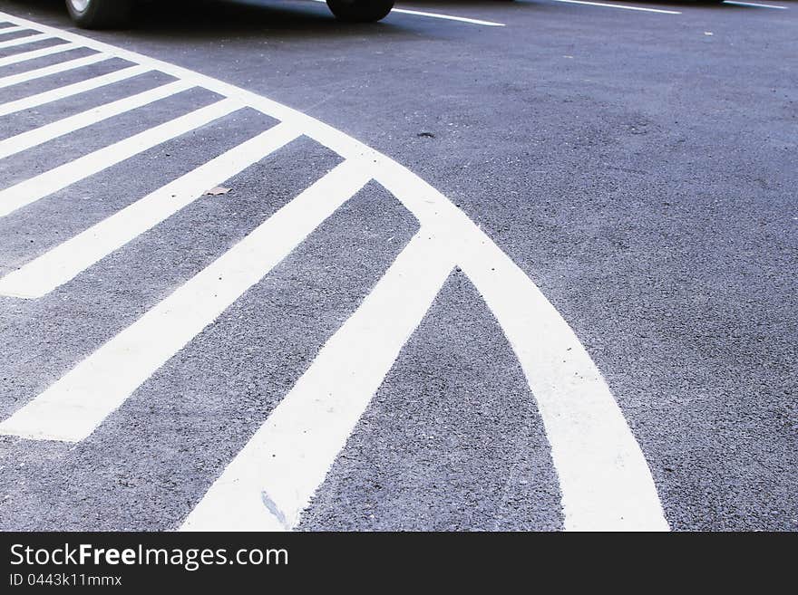 Markings on asphalt at car park area