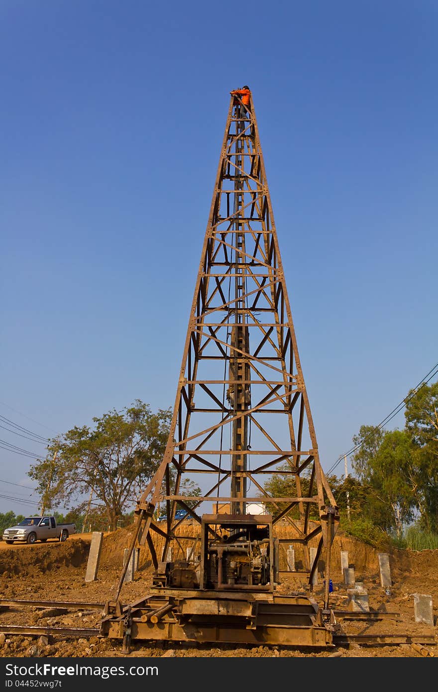 Workers on the Derrick to concrete piling in the streets. Workers on the Derrick to concrete piling in the streets.