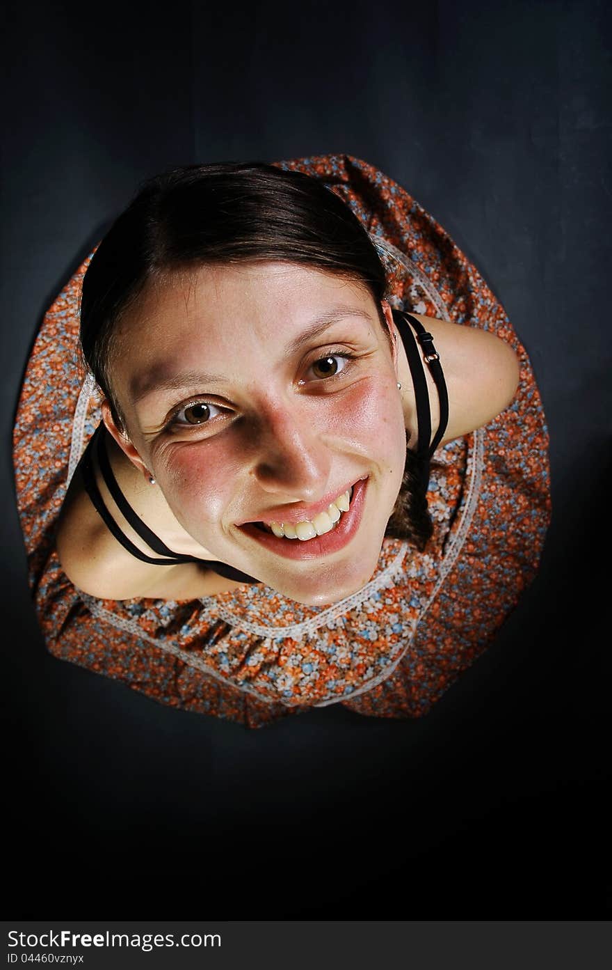 Smiling girl with skirt in the studio