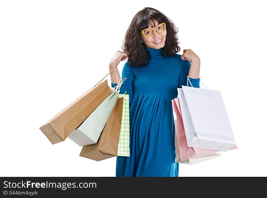 A happy shopping woman isolated over white background