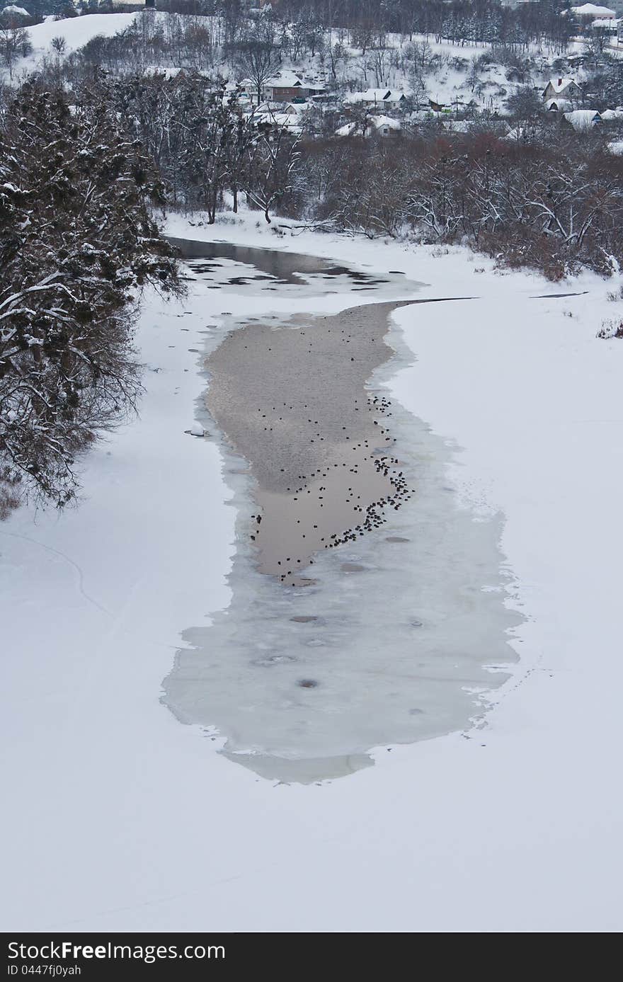 Winter landscape with frozen river and forest. Winter landscape with frozen river and forest