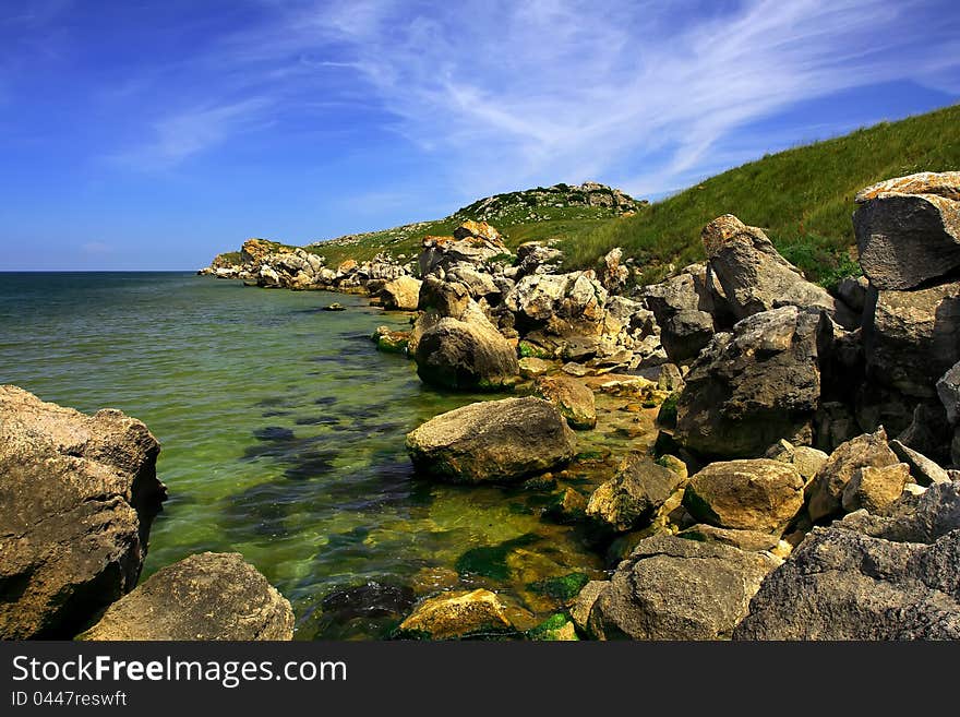 The sea shore with stones. The sea shore with stones