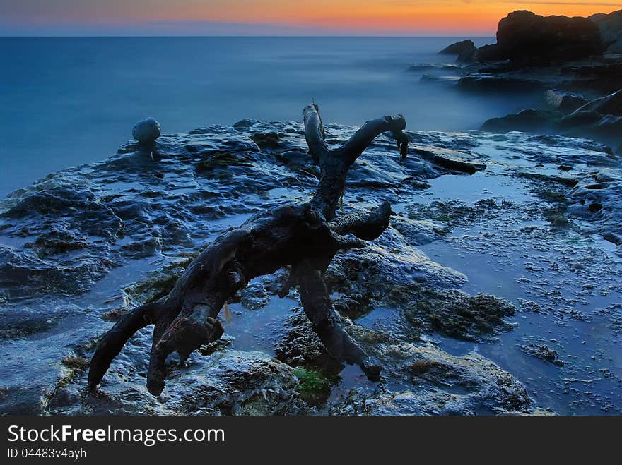 Rocky coastline on the sunset