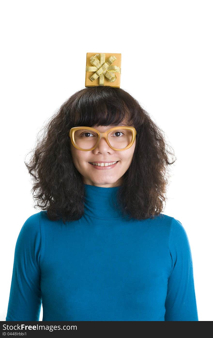 Brunette woman put gift on her head, isolated over white background. Brunette woman put gift on her head, isolated over white background