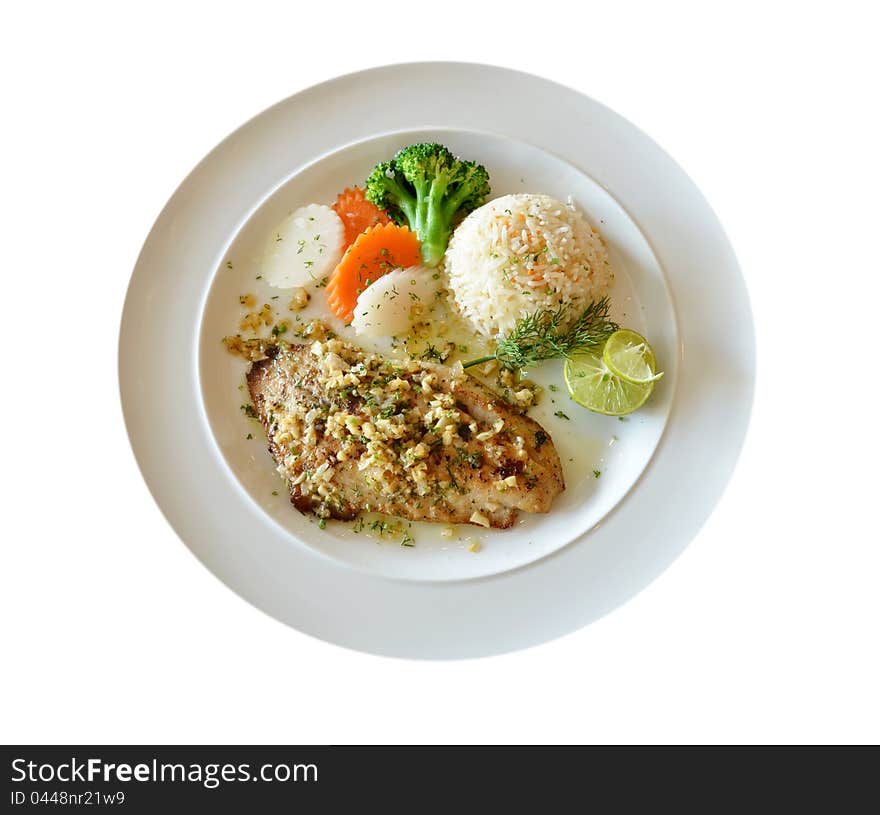 Roasted fish served with fried rice. Roasted fish served with fried rice