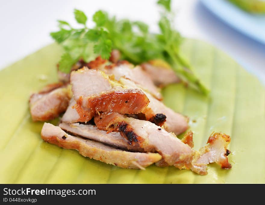 A delicious sliced grilled pork served  with vegetables. A delicious sliced grilled pork served  with vegetables