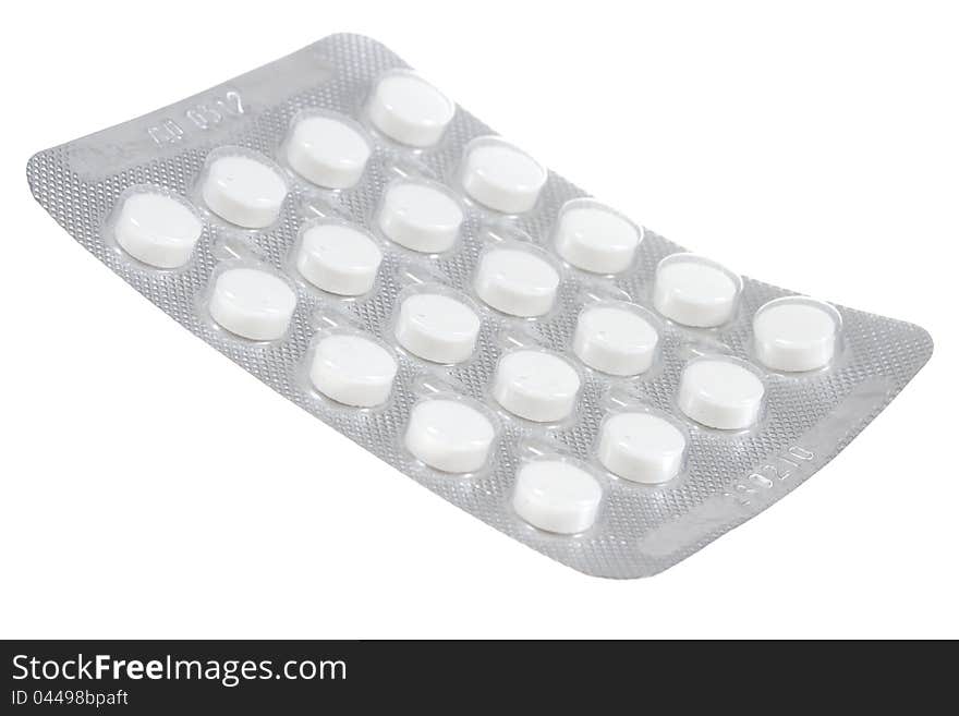 White pills isolated on a white