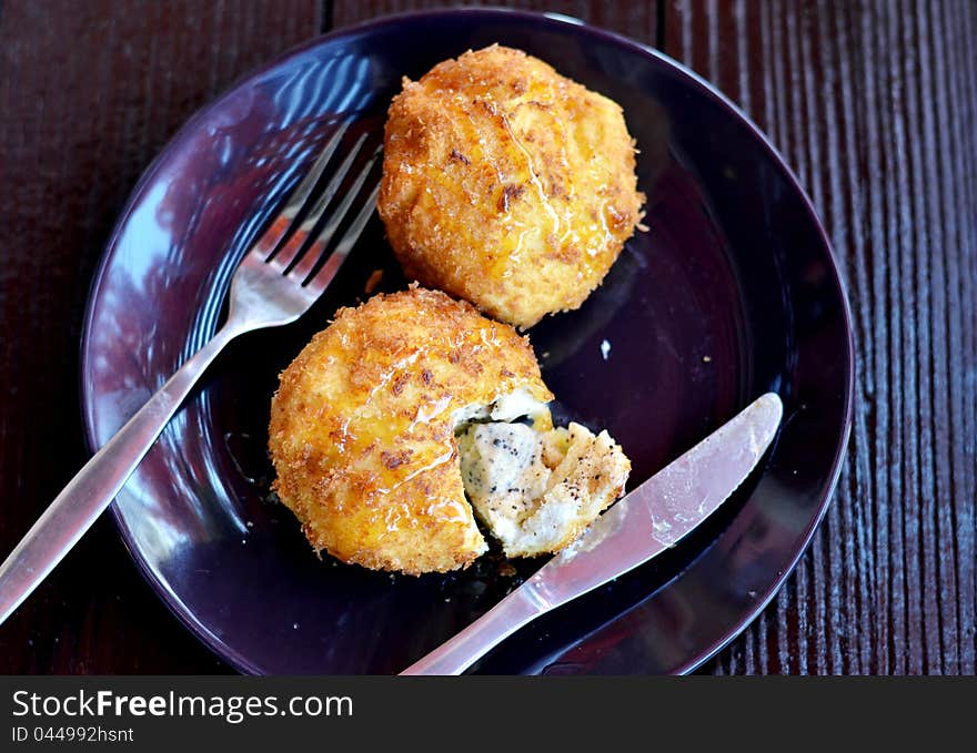 Deep fried bread served with honey sauce , ice cream inside. Deep fried bread served with honey sauce , ice cream inside