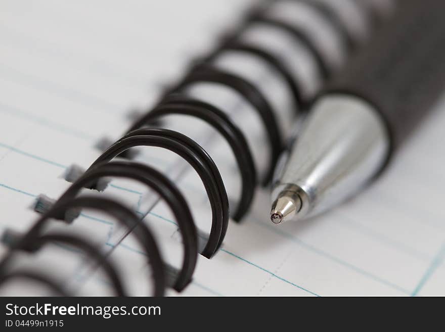 Spiral notebook with a pen. Spiral notebook with a pen