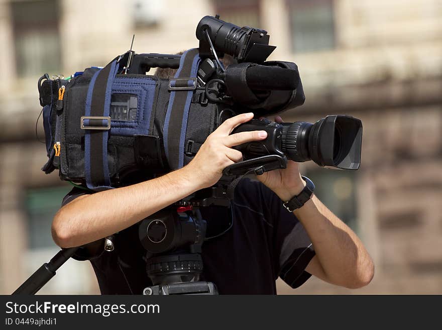 Cameraman working in the street. Cameraman working in the street