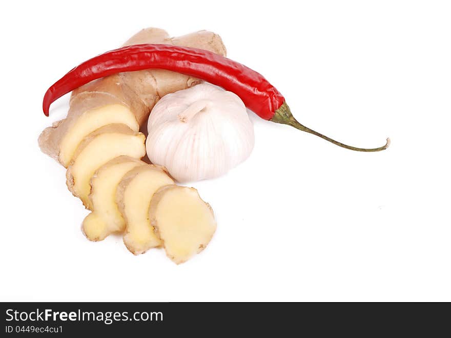 Garlic, hot red pepper and ginger over white background. Garlic, hot red pepper and ginger over white background