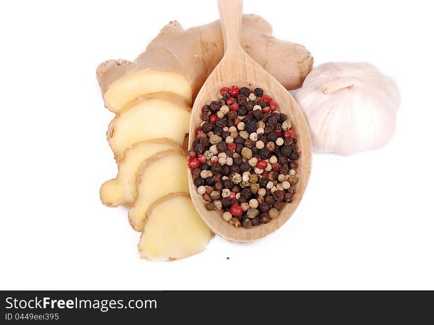 Garlic, ground peppers and ginger over white background. Garlic, ground peppers and ginger over white background