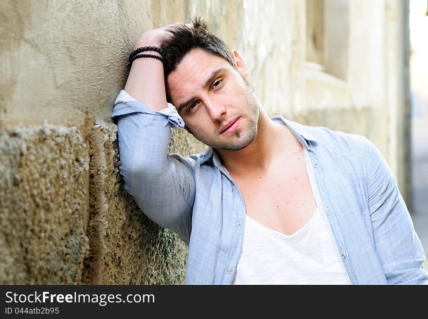 Portrait of handsome man in urban background