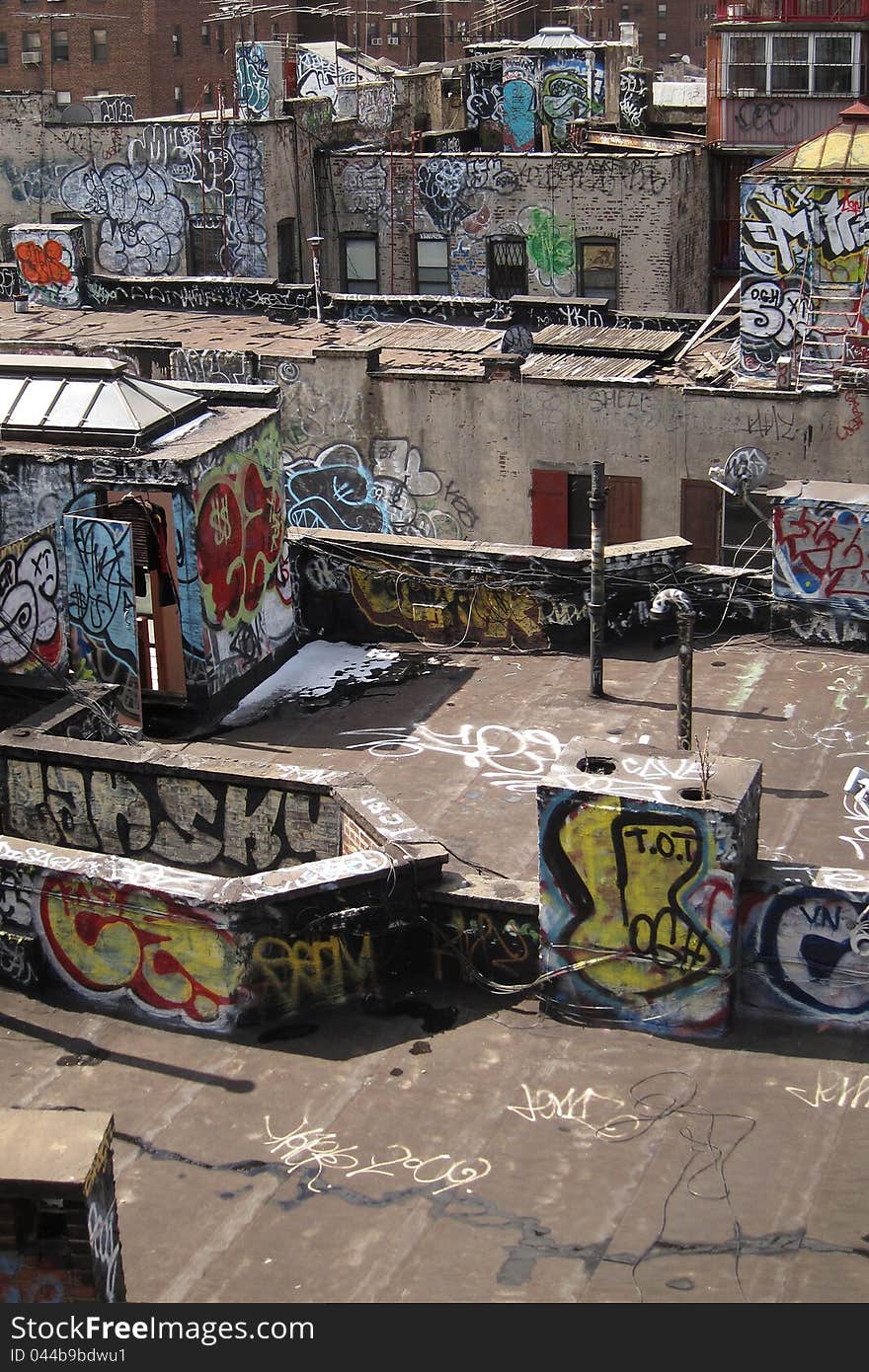 Damaged rooftops with graffiti artwork in New York, USA. Damaged rooftops with graffiti artwork in New York, USA.