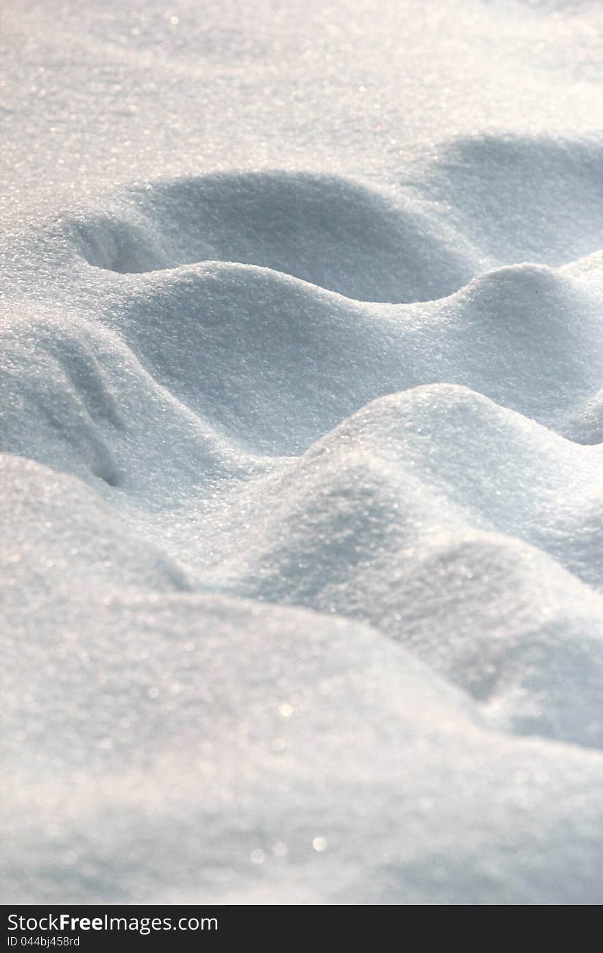 A macro photo of snowy ground. A macro photo of snowy ground