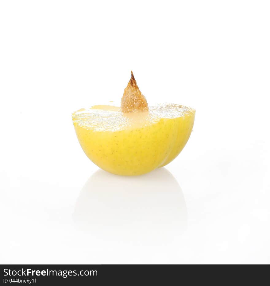 Half of plum on a white background