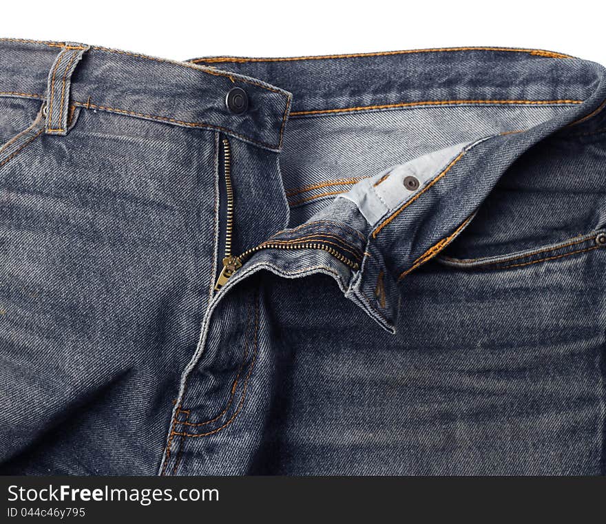 Worn jeans detail, metal zipper half open. Worn jeans detail, metal zipper half open