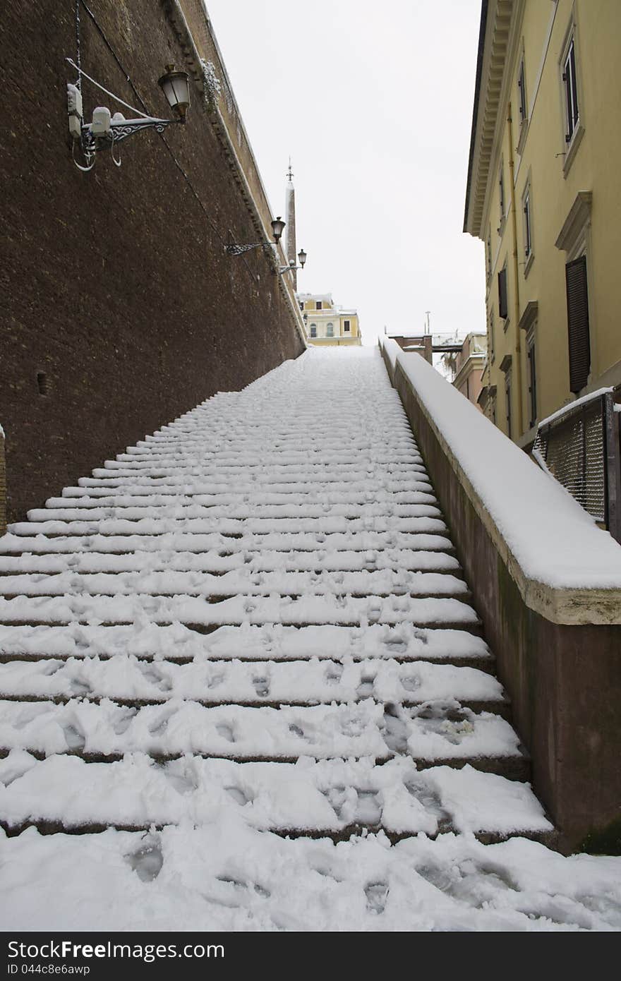 Ancient steps under snow in Rome Center