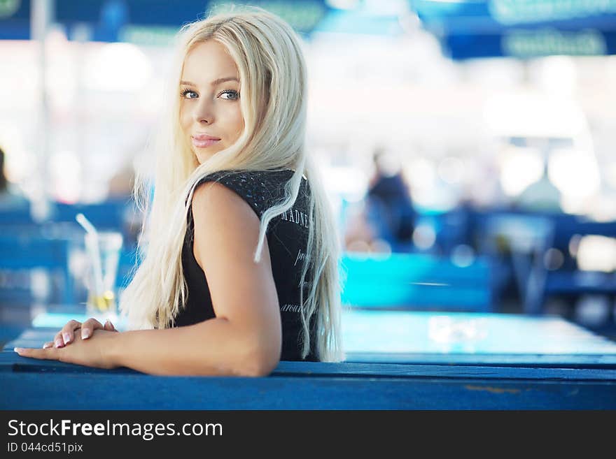 Portrait of a beautiful young blond woman in a cafe. Portrait of a beautiful young blond woman in a cafe