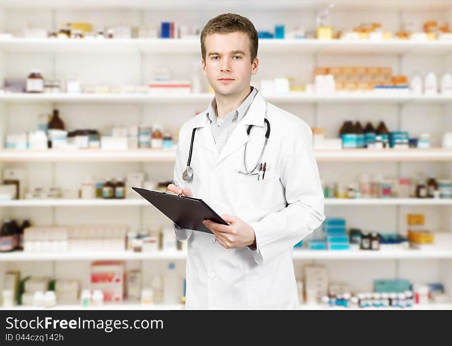 Portrait of a male pharmacist at pharmacy. Portrait of a male pharmacist at pharmacy