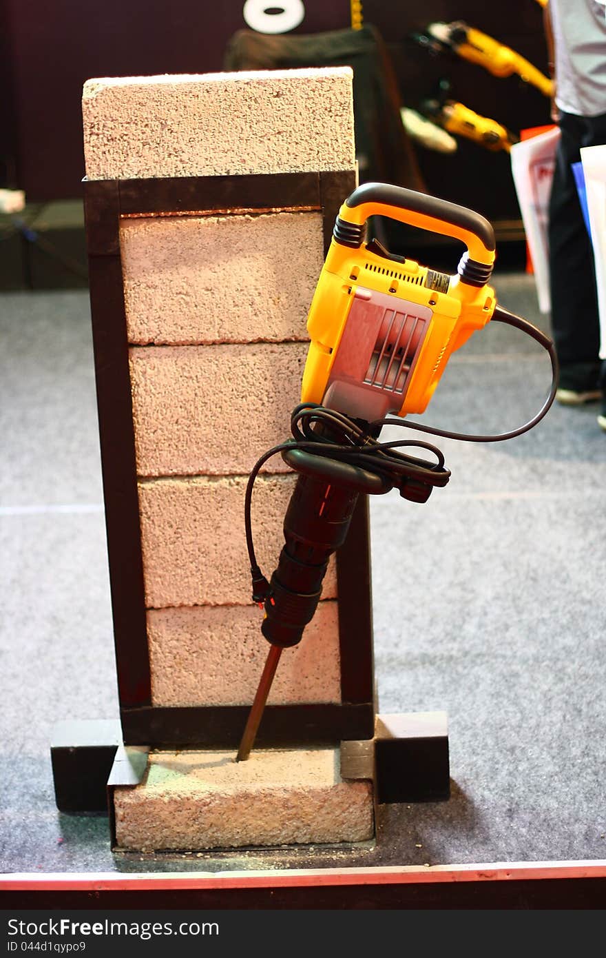 Yellow Demolition Hammer Breaking Brick Demo