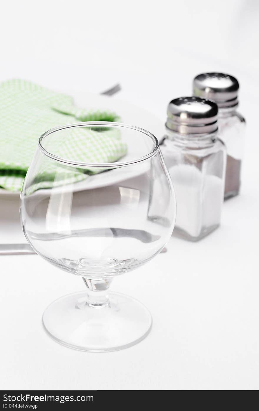 Empty wineglass on the served table at restaurant