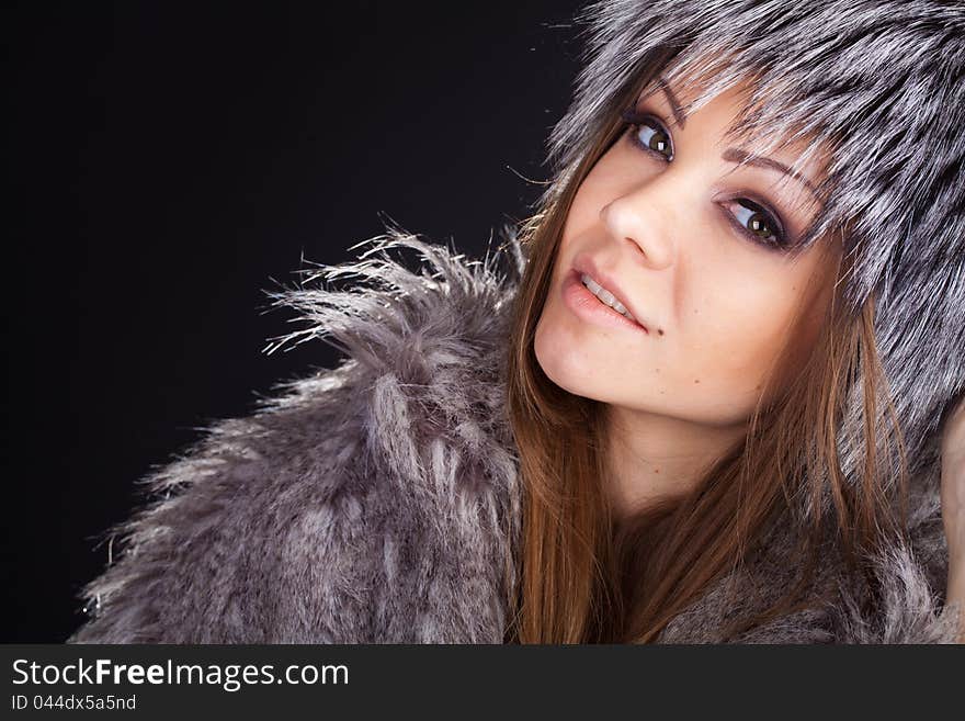 Portrait Of A Beautiful Smiling Woman In Furs