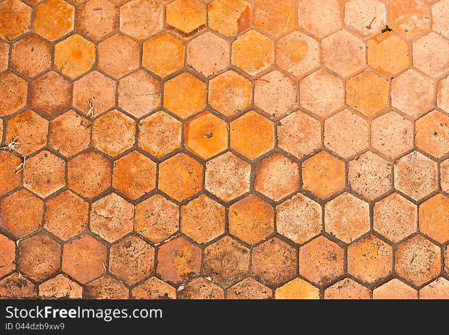 Pathway made by brown and orange hexagon bricks. Pathway made by brown and orange hexagon bricks