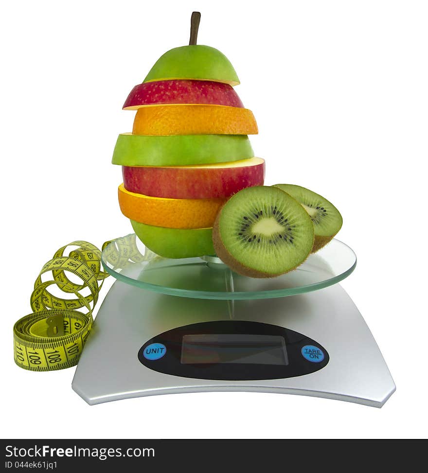 The mixed fruit on scales and a measurement tape. The mixed fruit on scales and a measurement tape