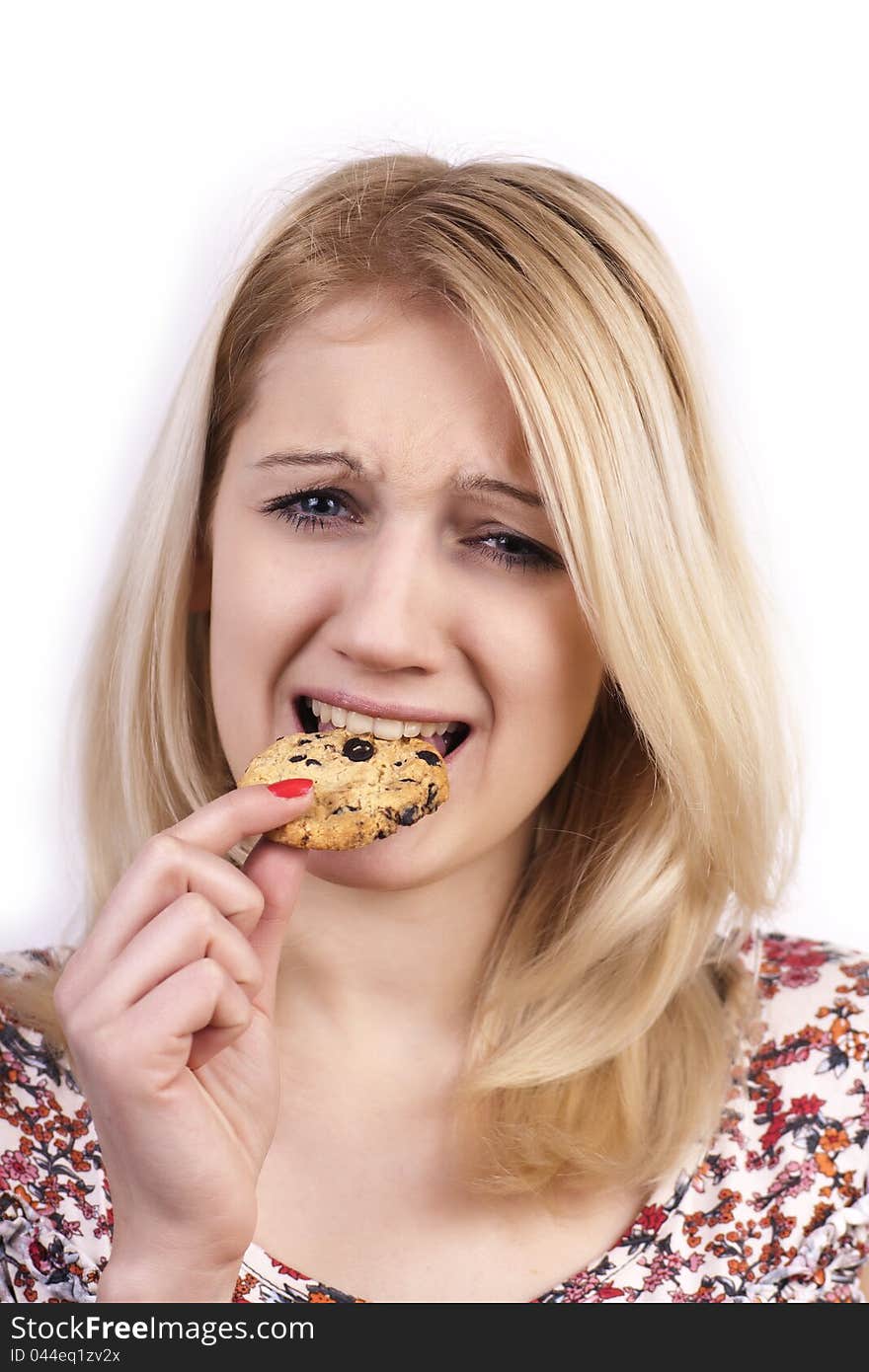 Young Woman Eating Cookie With Grimace